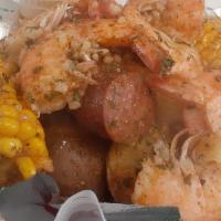 1/2 Lb Boiled Shrimp · Served with one corn and one potato tossed in Crave Garlic Butter sauce