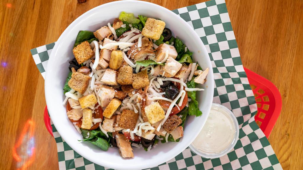 Marinated Chicken Salad · Grilled Chicken, tomatoes, black olives, and mozzarella cheese.