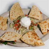 Quesadillas Mexicanas · Three flour quesadillas filled with scrambled eggs, white cheese and your choice of Mexican ...
