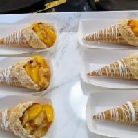 Peach Cobbler Cones (2) · 2 Waffle Cones Drizzled in White Chocolate Stuffed with Southern Peach Cobbler