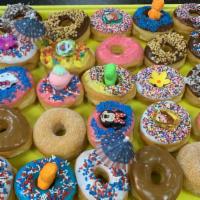 Dozen Assorted Donuts · Includes sprinkles, glaze, chocolate, strawberry iced, vanilla iced, cake.