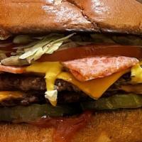 Backyard Burger · House Patty, Smoked Bacon, Cheddar Cheese, Pickle, Lettuce, Tomato, Ketchup & Mustard