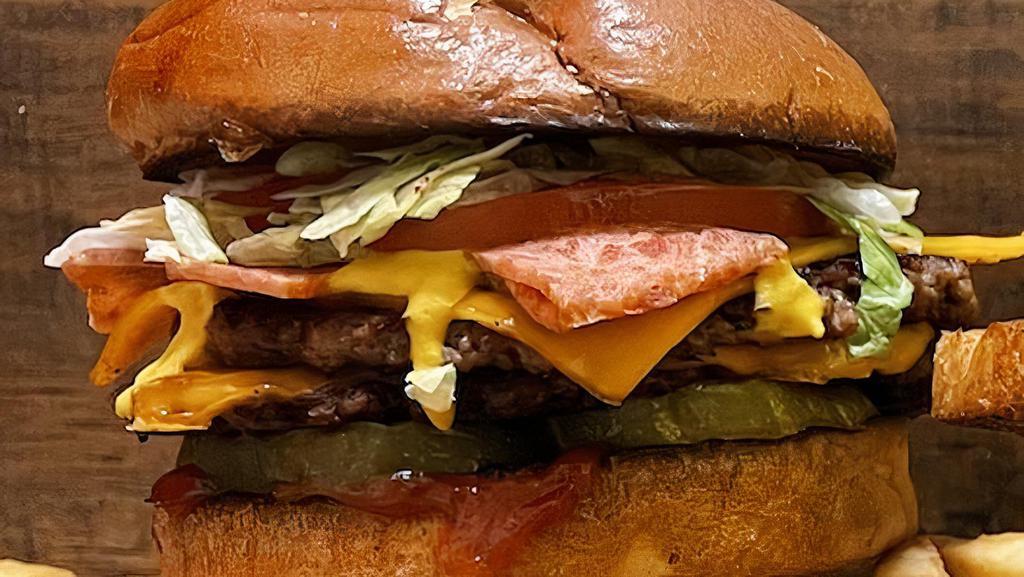 Backyard Burger · House Patty, Smoked Bacon, Cheddar Cheese, Pickle, Lettuce, Tomato, Ketchup & Mustard