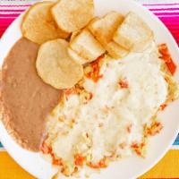 Migas · Eggs, chips, pico de gallo, cheese, beans, potatoes.