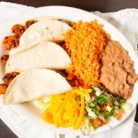 Taco Plate · 3 Tacos of your choice of meat.
Served with rice & beans
