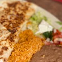 Quesadilla Beef, Chicken Or Spinish · Large flower tortilla with your choice of meat
Served with salad, rice & beans