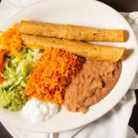 Flautas De Pollo · 2 Rolled deep fried corn tortilla filled with chicken
Served with rice, bean, salad, guacamo...