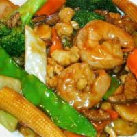 Triple Delight With Garlic Sauce · Spicy. Jumbo shrimp, Chicken and beef with broccoli green pepper, baby com.carrot and bamboo...