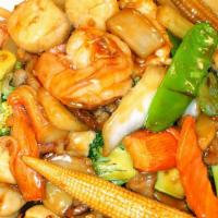 Happy Family · Jumbo shrimp, Chicken, beat and crabmeat with med vegetable in brown sauce.
