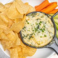 Spinach & Artichoke Dip · Three cheese blend, roasted garlic, spinach & artichoke, served with house chips, carrots & ...