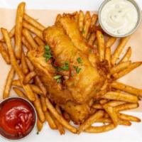 English Fish N Chips · Crispy cod served atop beer battered fries served with malt vinegar and house-made tartar sa...