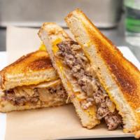 Patty Melt · Fresh ground sirloin, topped with Guinness caramelized onions, 1000 island dressing & chedda...
