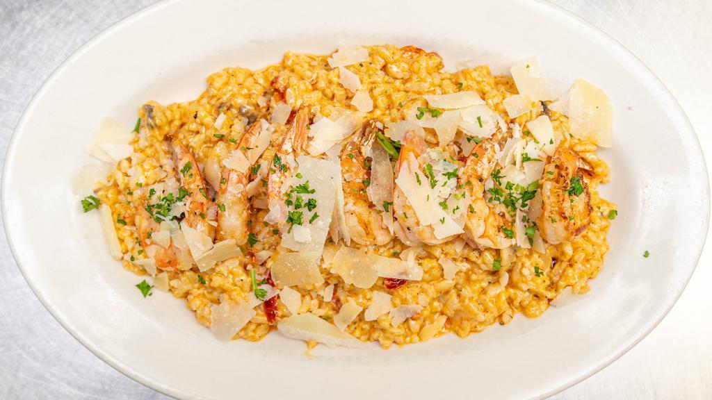 Shrimp Risotto · Texas gulf shrimp atop a creamy saffron sun-dried tomato & mushroom risotto.