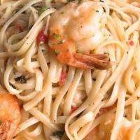 Shrimp Scampi · Fresh garlic and basil cooked with a butter lemon sauce, with a light touch of marinara. Ser...