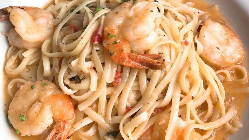 Shrimp Scampi · Fresh garlic and basil cooked with a butter lemon sauce, with a light touch of marinara. Served with shrimp over linguine pasta.
