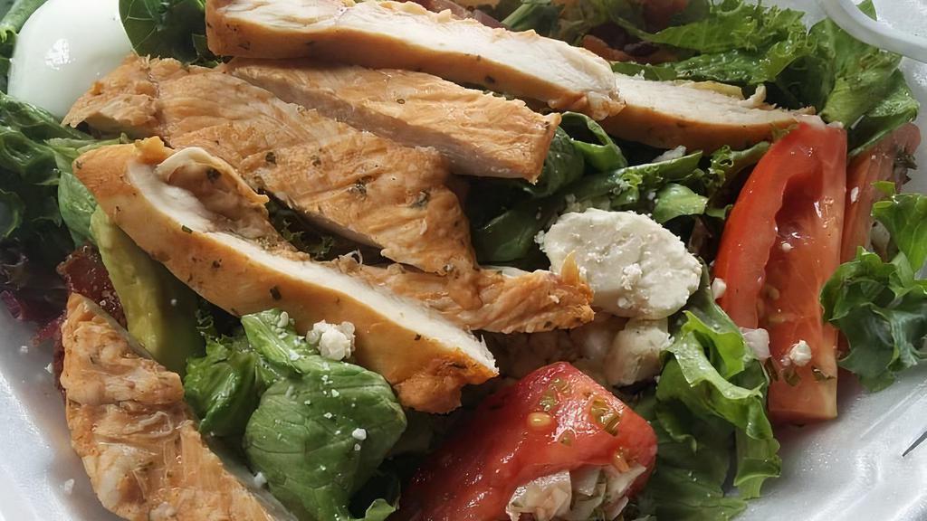 Cobb Salad · Marinated chicken breast, mixed greens, tomatoes, avocado, egg, bacon, blue cheese crumbles and tossed with blue cheese dressing.