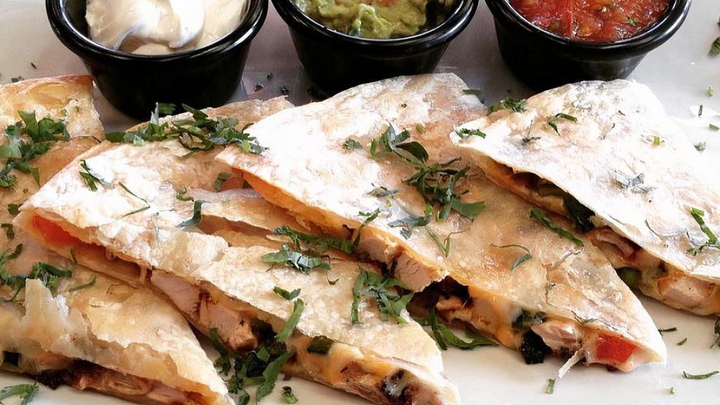 Chicken Quesadilla · Grilled chicken, roasted poblanos, Monterey jack & cheddar cheeses, hatch green chile peppers, sour cream & pico de gallo.