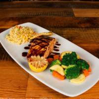 Fresh Grilled Salmon · Grilled, basted with a teriyaki sauce. Served with rockin' rice & steamed vegetables.