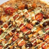 Spicy Buffalo Chik'N Pizza · Roasted habanero ranch sauce, grilled chicken, red jalapeño, baby spinach, red onion, grape ...