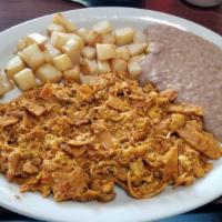 Migas Nortenas Plate · Tostada chips mixed with two eggs and red sauce.