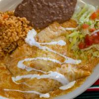Enchiladas En Salsa De Chipotle Plate · Three chicken enchiladas topped with creamy chipotle sauce and topped with queso fresco.