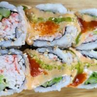 Mexican Roll · (IN - Crabmeat, avocado, and cucumber) , 
(Out - 3 spicy sauces on top)