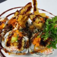 Spider Roll · (IN - Deep fried soft shell crab, with cucumber, crabmeat, avocado) ,  
(Out - Eel sauce and...