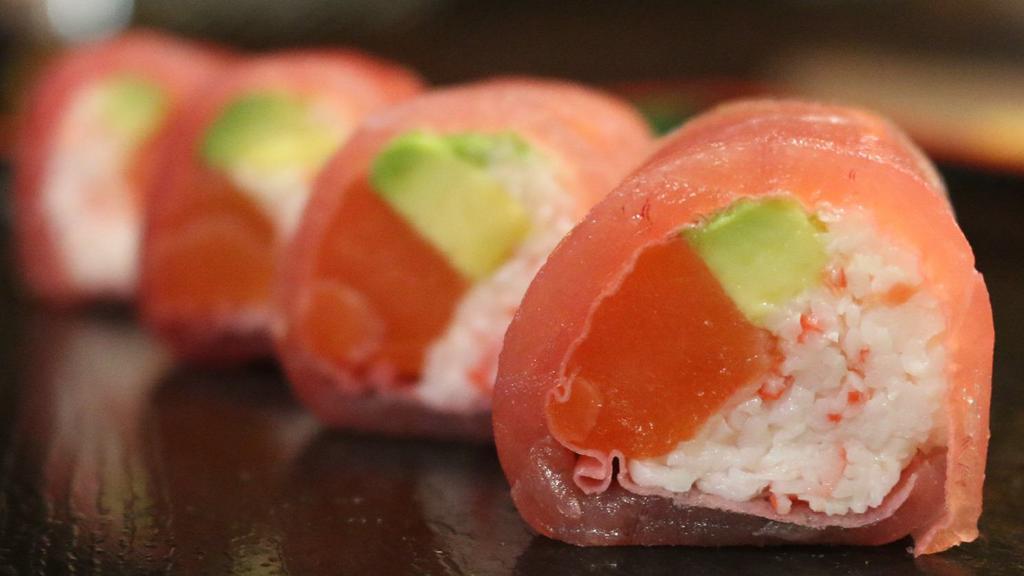 Love Love Roll · (IN - Crab meat , fresh  salmon, avocado) , 
(Out - Wrapped   in Fresh tuna and soy paper with spicy miso sauce)