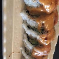 Texas Ranger · Crabmeat, cream cheese, topped with salmon, eel sauce, creamy sauce, masago, and scallions