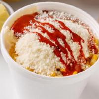 Elote En Vaso (Street Corn) · Corn, mayo, butter, cotija cheese, chile sauce on the side.