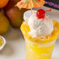 Piña Colada · Pineapple snow cone, coconut ice cream, chunks of real pineapple, coconut flakes.