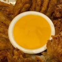 Blooming Onion · Spicy. Fresh onion cut and coated in seasoned batter and fried until golden brown and crispy...