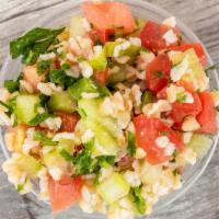 Tabbouleh  · Mediterranean salad made with bulgur crushed wheat, celery, cucumber, parsley, mint, tomato,...