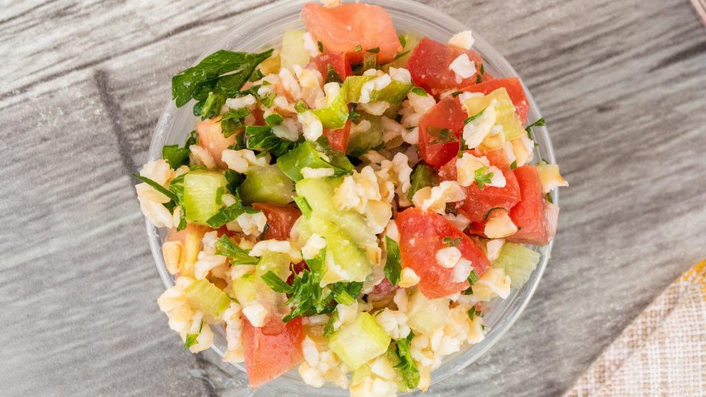 Tabbouleh  · Mediterranean salad made with bulgur crushed wheat, celery, cucumber, parsley, mint, tomato, green onion, olive oil, salt and lime juice.
