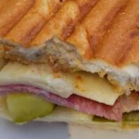 Cuban · Ham, salami, swiss cheese, pickles, and dijon mustard on cuban bread.