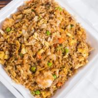 Combination Fried Rice · Rice with chicken, pork, and shrimp.