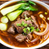 Szechuan Beef Noodle Soup · Fresh handmade noodle in a szechuan spicy sauce with chunks of beef and vegetable.