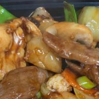 Happy Family · White meat chicken, beef, shrimp, scallop and crab meat sautéed with assorted vegetables in ...