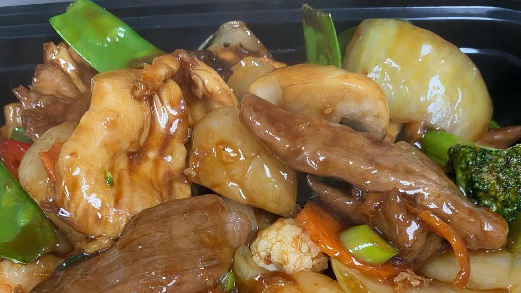 Happy Family · White meat chicken, beef, shrimp, scallop and crab meat sautéed with assorted vegetables in a brown sauce.