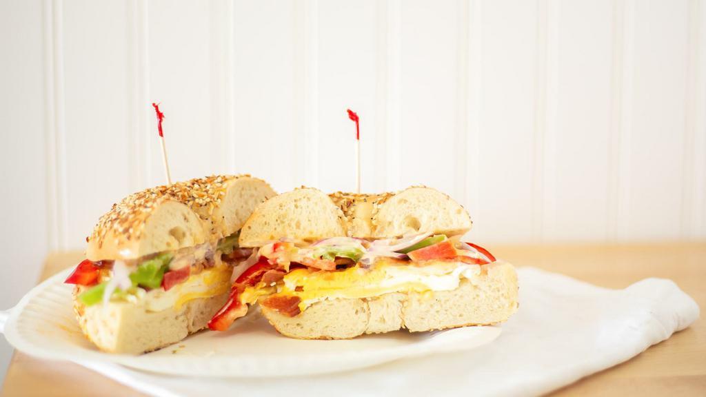 Western Sandwich · Eggs, bacon, cheddar, chipotle sauce, green pepper, red pepper, and red onion.
