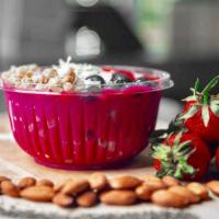 Dragon Bowl 16Oz · Pitaya, almond mylk, strawberry, banana base topped with seasonal fruit.