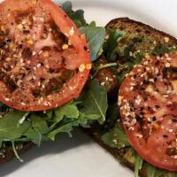 Avocado Toast · One slice or two. Whole wheat bread, topped with avocado, tomato, arugula, EVOO, and Everyth...