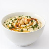Hummus · Chickpea spread made with tasty Tahini, Roasted Garlic, Fresh Lemon Juice and Olive Oil. Ser...