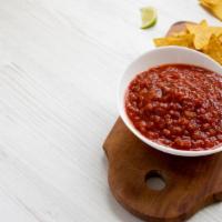 Charred Salsa · Satisfying Salsa made with Heirloom Tomatoes, Onion, Garlic, Hot Jalapeño and Fresh Cilantro...