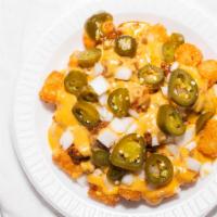 Chili Cheese Tots · Served with Queso