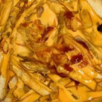 Cheesesteak Fries · Steak meat and seasoned fries topped with American Melted cheese