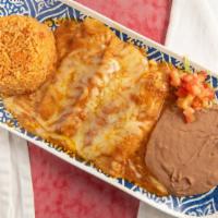 Shredded Chicken Enchiladas  W/ Ranchero Sauce · Served with rice and refried beans.