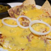Bean & Cheese Nachos · Crisp tostadas covered with refried beans and melted cheese.  Topped with onion rings and se...