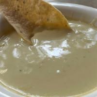 Poblano Queso · Roasted poblano peppers blended with smooth and melted American and Chihuahua cheeses.