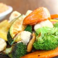Grilled Vegetable Fajitas · Fresh zucchini, mushrooms, carrots, and squash grilled with tomato wedges, broccoli, and cau...